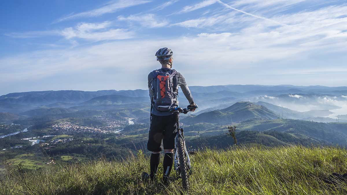 Mountain biker overlooking a valley