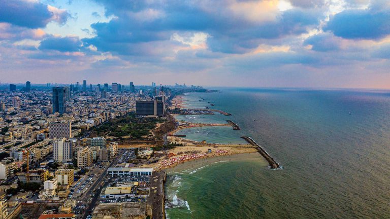 Urban building meets the shoreline in Tel Aviv, Israel.