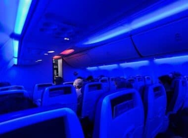 Interior of a Southwest plane with strong blue lighting.