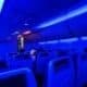 Interior of a Southwest plane with strong blue lighting.