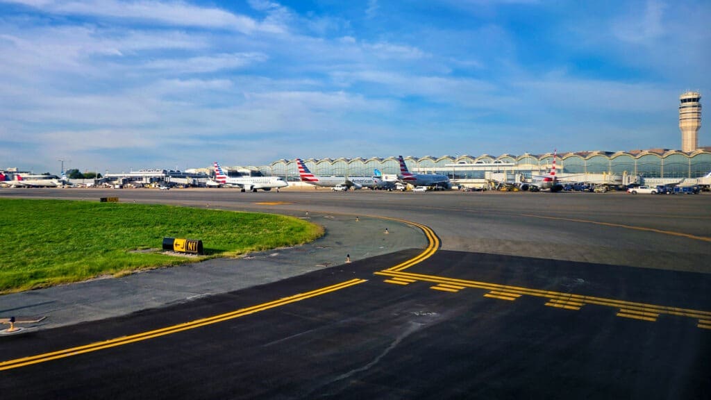 Different planes standing at different gates at the Washington National airport.