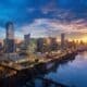 Austin skyline along the Colorado River during a colorful sunrise.